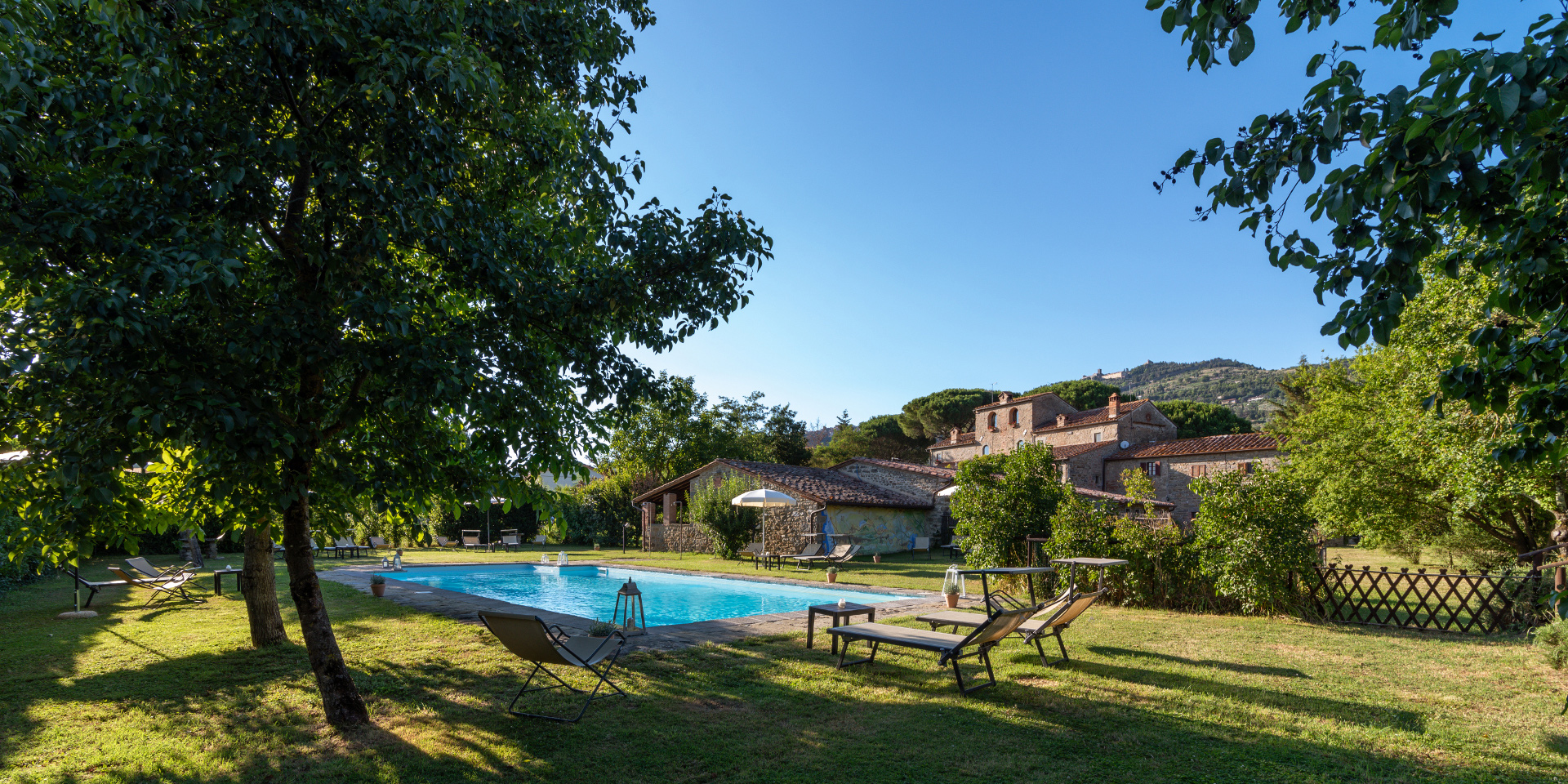 Park and pool in the ancient Monastero San Silvestro Farmhouse